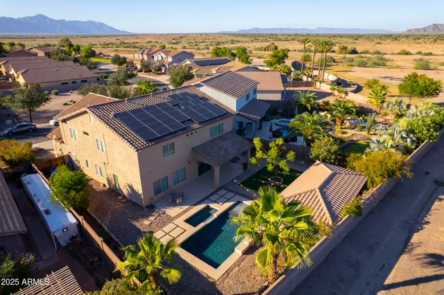 an aerial view of residential houses with outdoor space and river