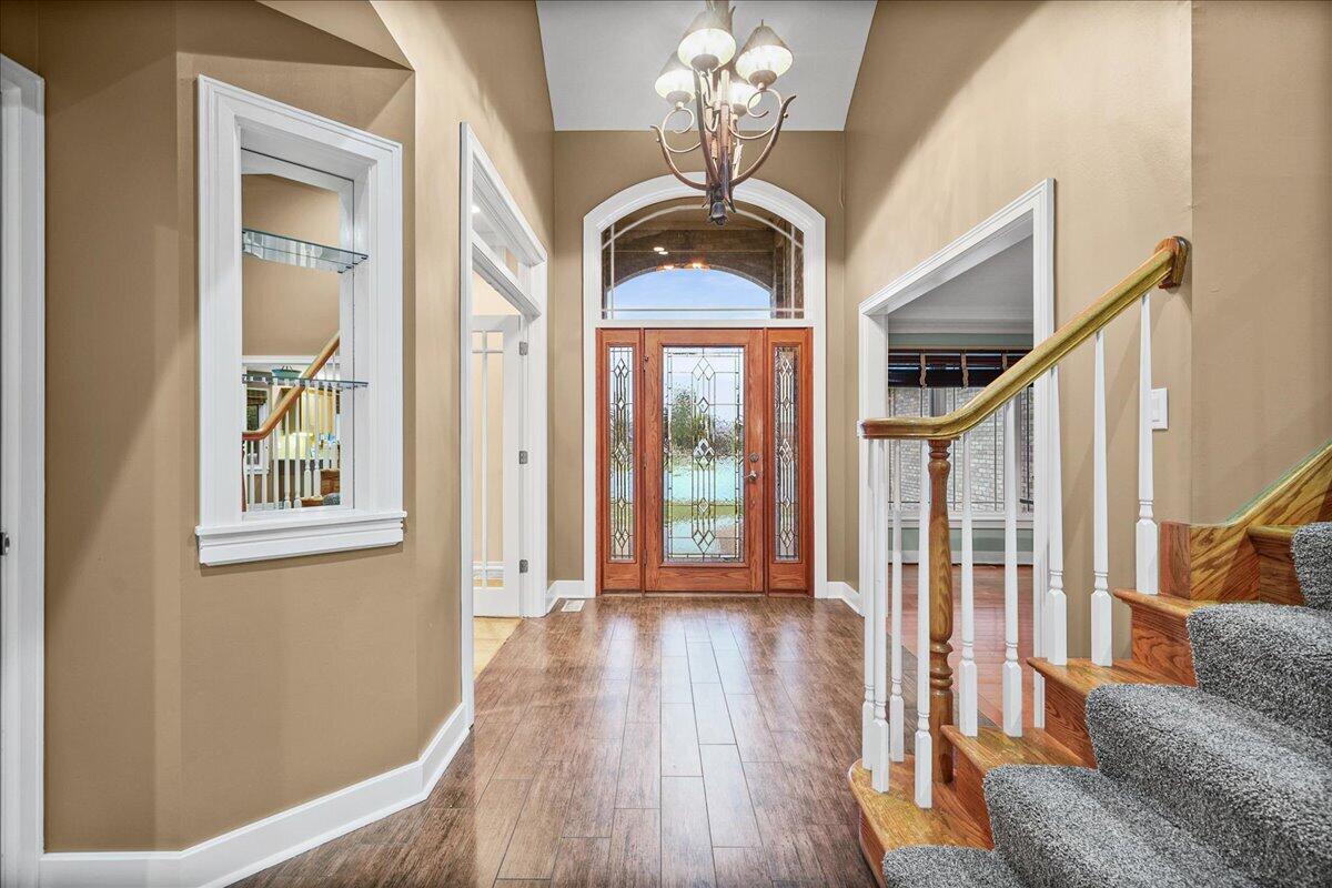 8751 Bridgewater Court Crown Point, IN 46307 - Photo 20 of 49 a view of a livingroom with furniture wooden floor and windows