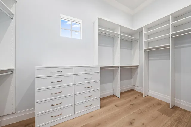a view of an empty walk in closet