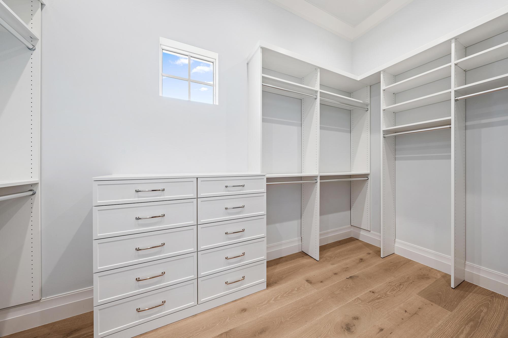 2917 Bluewater Cove Gulf Stream, FL 33483 - Photo 23 of 37 a view of an empty walk in closet