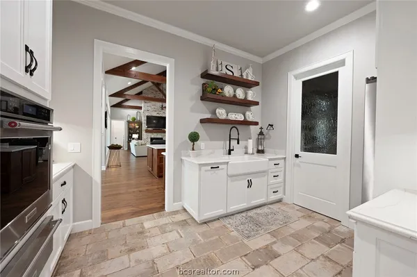 a room with a cabinets and a window