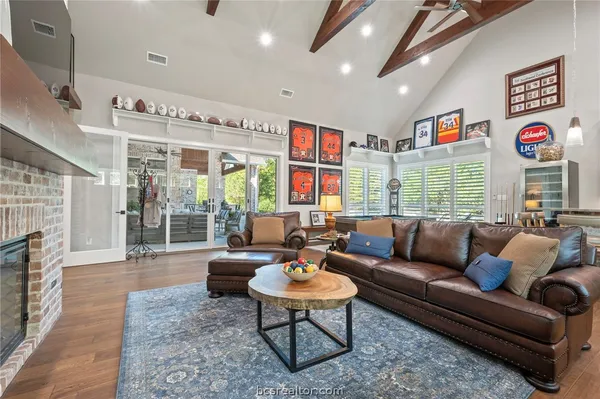a living room with furniture a rug and a large window