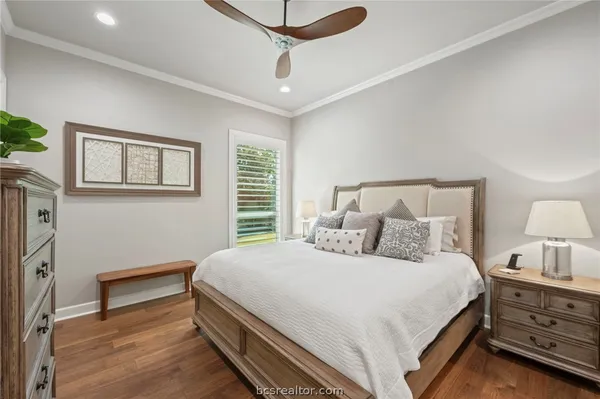 a bedroom with a bed and a night stand