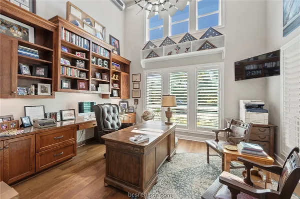 a reading room with furniture cabinets and a window