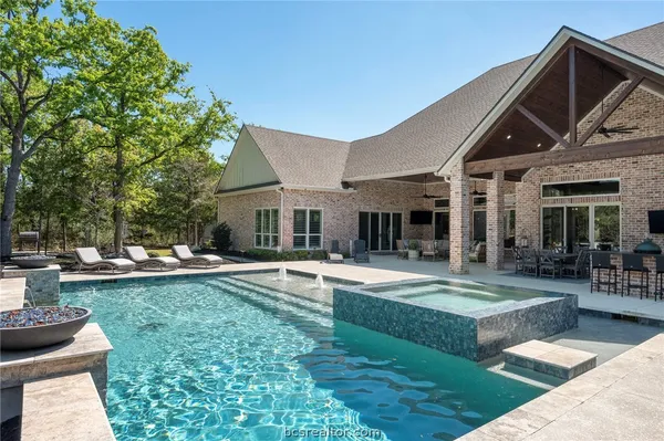 a view of swimming pool with seating space