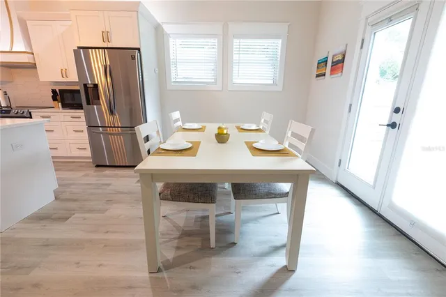 a kitchen with stainless steel appliances a stove a refrigerator and a refrigerator