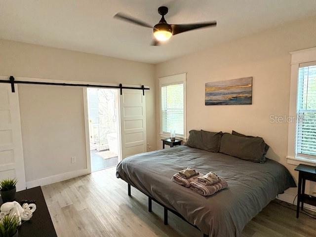 507 East Paris Street Tampa, FL 33604 - Photo 14 of 25 a bedroom with a bed and a window