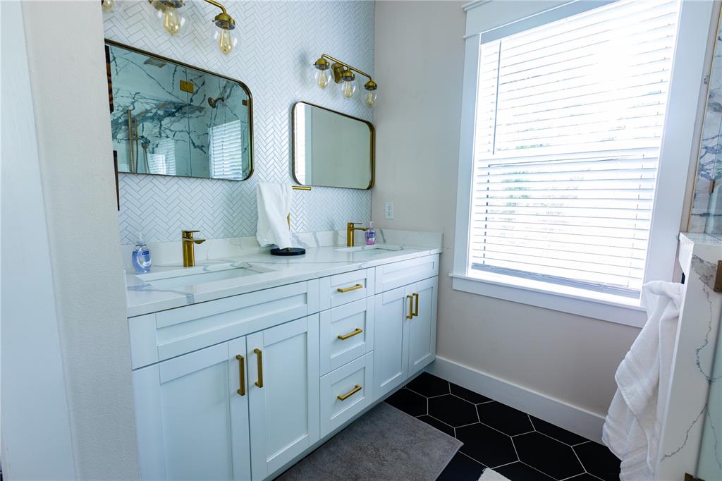 507 East Paris Street Tampa, FL 33604 - Photo 18 of 25 a bathroom with a double vanity sink and a window