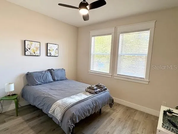 a bedroom with a bed and a window