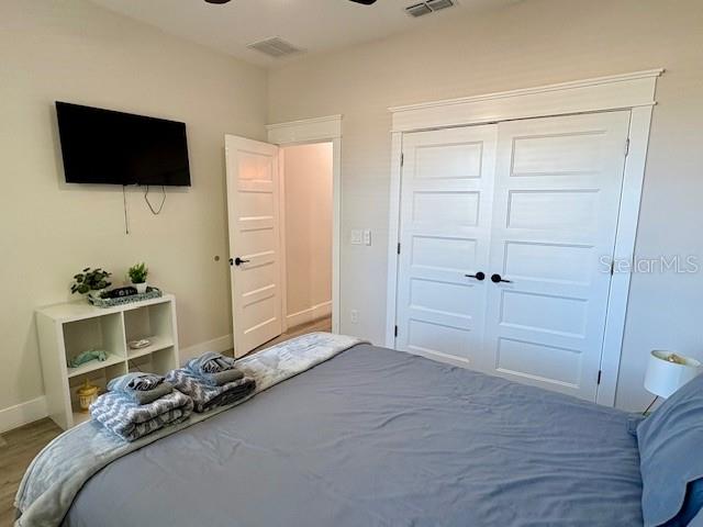 507 East Paris Street Tampa, FL 33604 - Photo 23 of 25 a bedroom with a bed and a flat screen tv