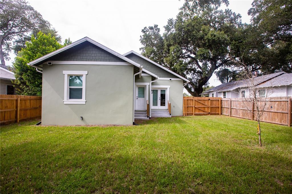507 East Paris Street Tampa, FL 33604 - Photo 25 of 25 a view of a yard in front of a house with large trees