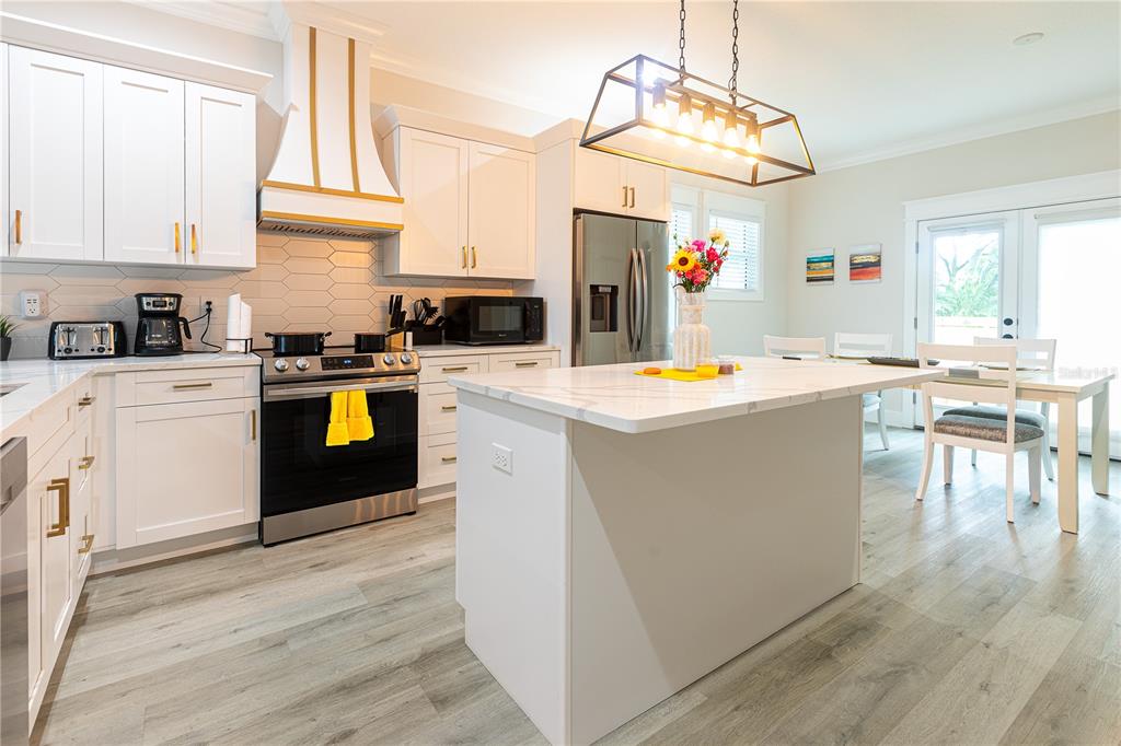 507 East Paris Street Tampa, FL 33604 - Photo 7 of 25 a kitchen with a sink stove and cabinets
