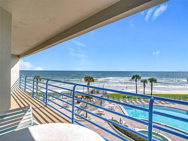 a view of swimming pool with outdoor seating