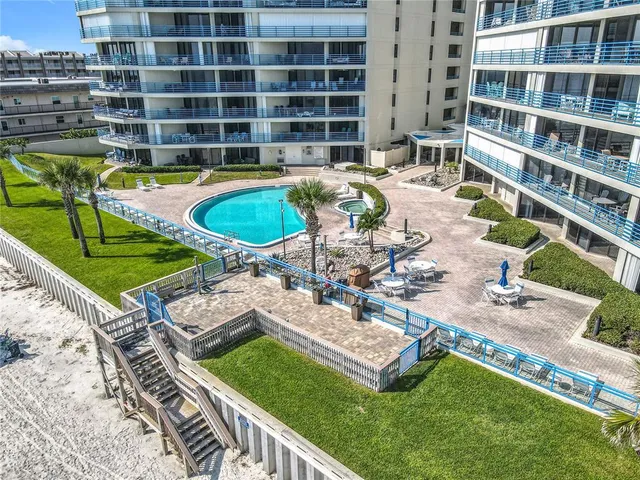 a view of a swimming pool with a lounge chairs