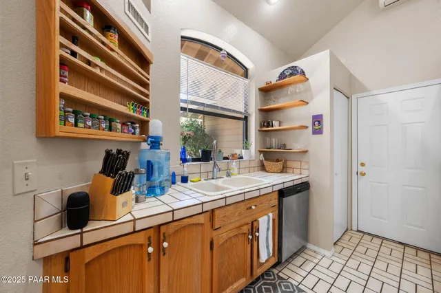a kitchen with a sink and cabinets