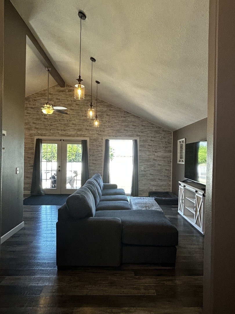 12795 Lawrence Road Sterling, IL 61081 - Photo 12 of 42 a living room with furniture and a chandelier