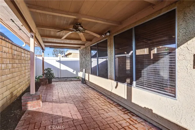 a view of a backyard with wooden walls