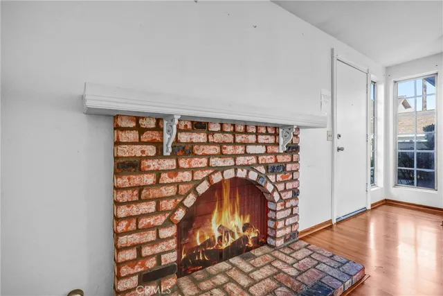 wooden floor in an empty room with a bench