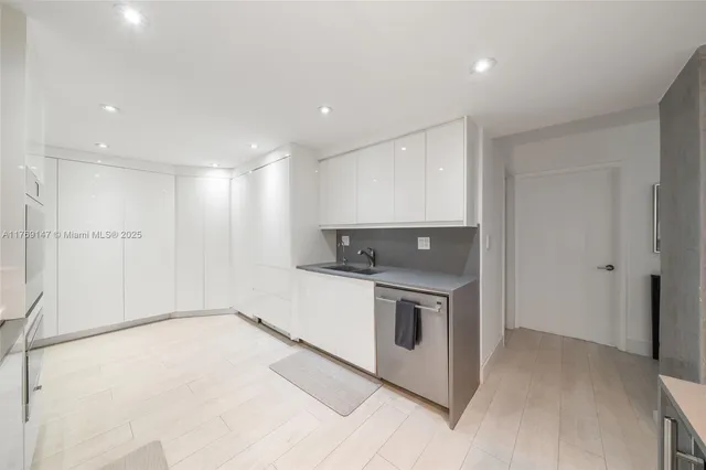 a view of a kitchen with a stove top oven