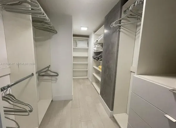 a bedroom with a bed and chair