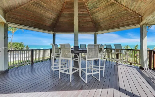 a view of a balcony with chairs