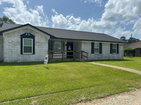 90 Live Oak Street Coldspring, TX 77331 - Photo 12 of 12 a front view of a house with garden