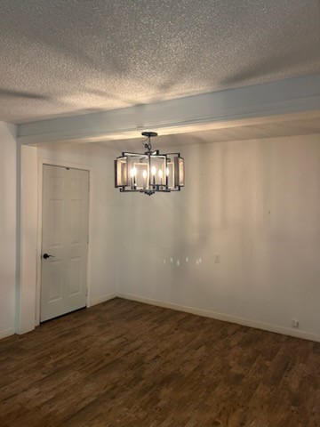 90 Live Oak Street Coldspring, TX 77331 - Photo 4 of 12 a view of an empty room with wooden floor and chandelier