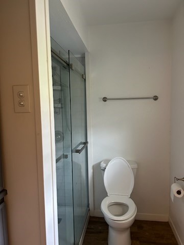 90 Live Oak Street Coldspring, TX 77331 - Photo 7 of 12 a bathroom with a toilet and a shower