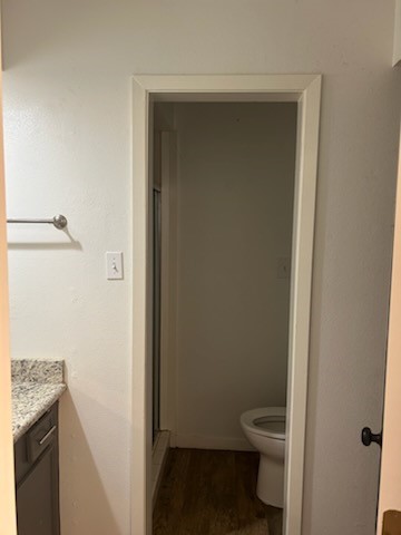 90 Live Oak Street Coldspring, TX 77331 - Photo 9 of 12 a bathroom with a granite countertop toilet and a sink