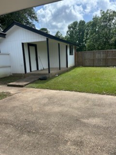 90 Live Oak Street Coldspring, TX 77331 - Photo 10 of 12 a view of backyard of house