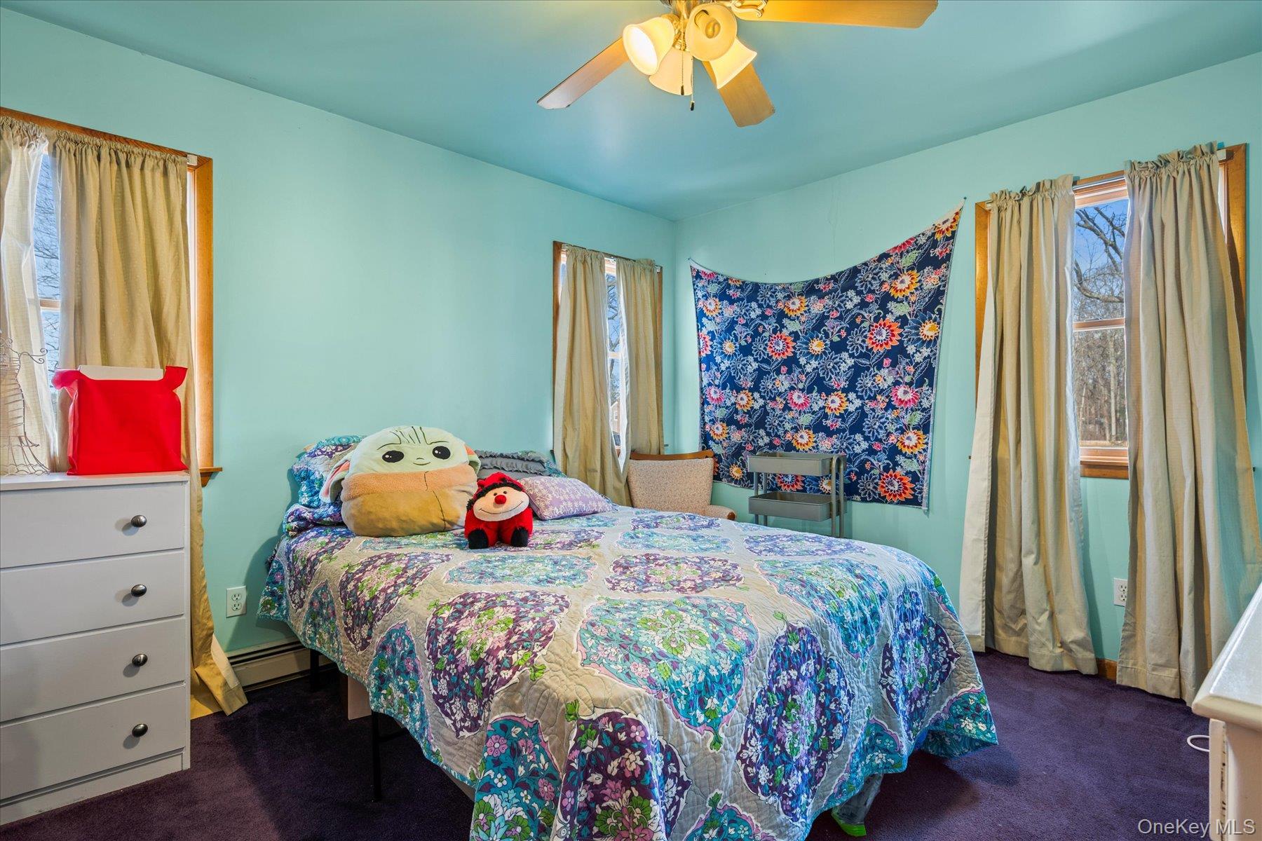 214 Pipe Stave Hollow Road Mount Sinai, NY 11766 - Photo 10 of 25 a bedroom with a bed and a window