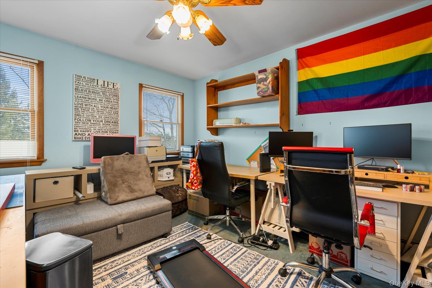 214 Pipe Stave Hollow Road Mount Sinai, NY 11766 - Photo 13 of 25 a living room with furniture a flat screen tv and a window