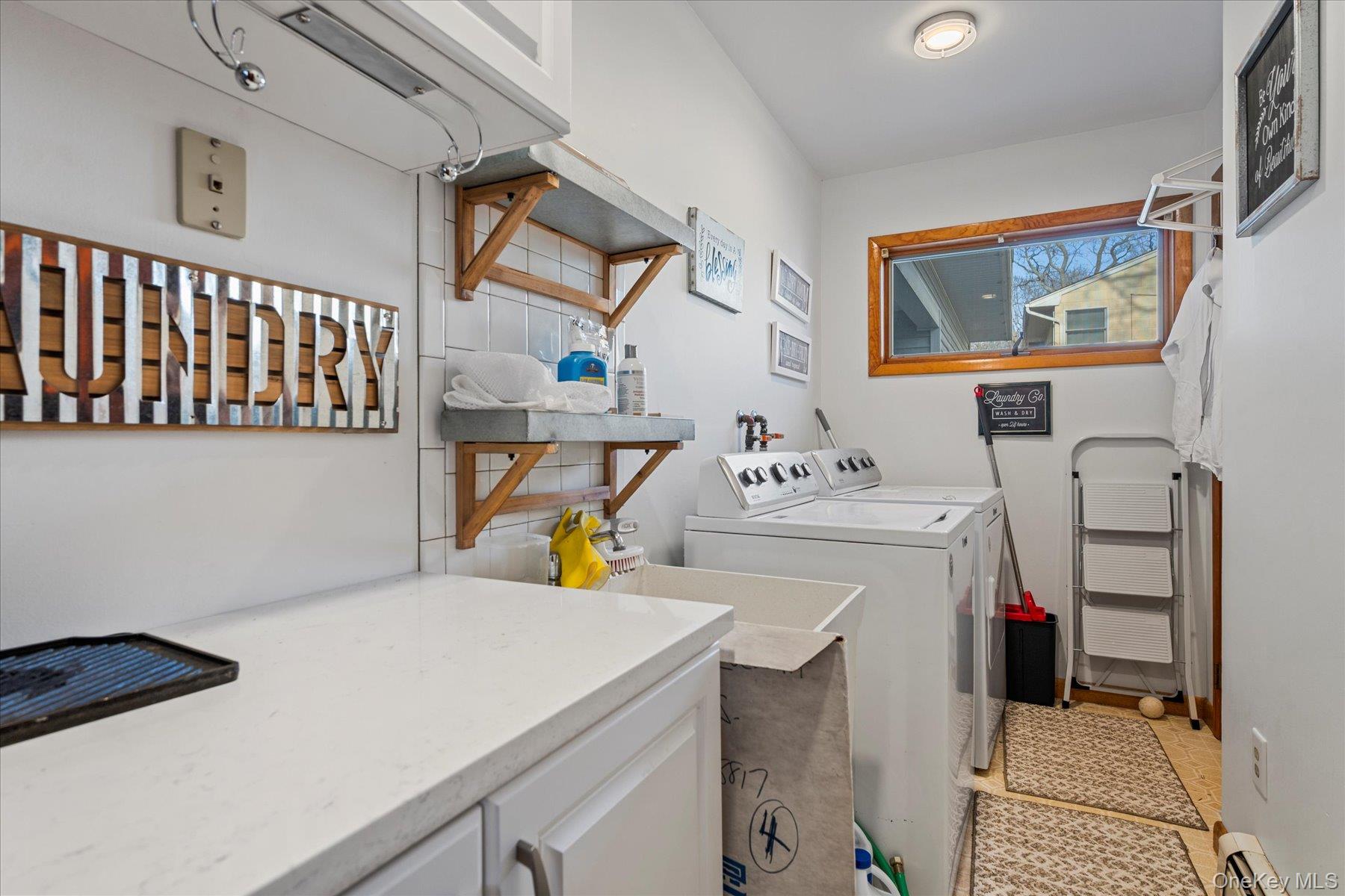 214 Pipe Stave Hollow Road Mount Sinai, NY 11766 - Photo 19 of 25 a utility room with a sink dryer and washer