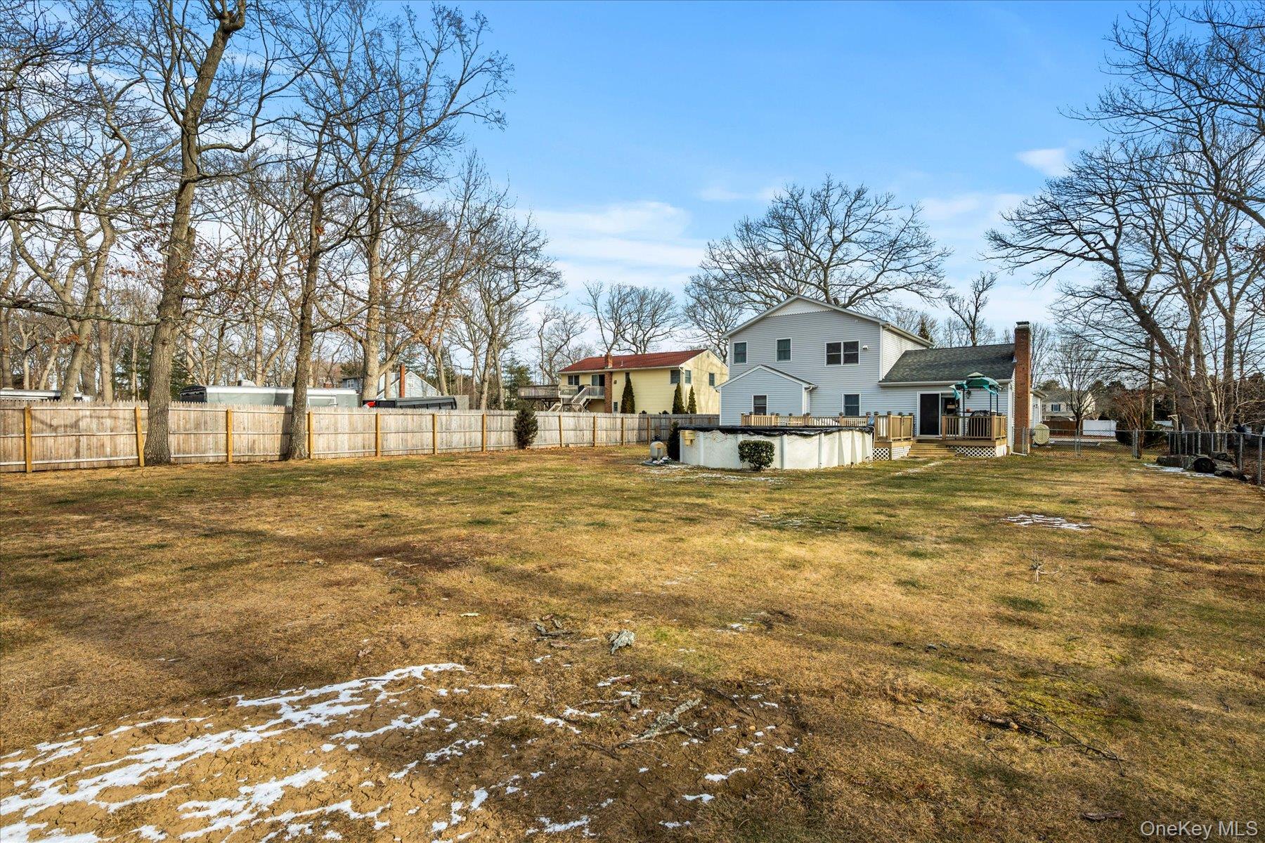 214 Pipe Stave Hollow Road Mount Sinai, NY 11766 - Photo 23 of 25 a large tree in front of a house