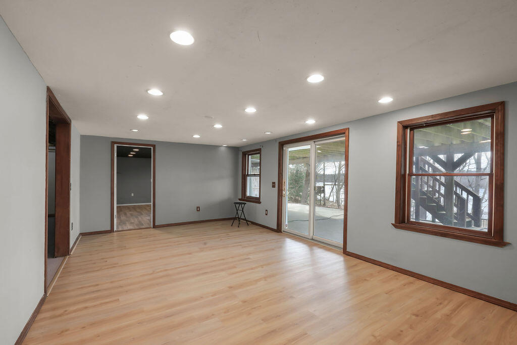 75 Edgewater Road Mashpee, MA 02649 - Photo 52 of 78 an empty room with wooden floor and windows