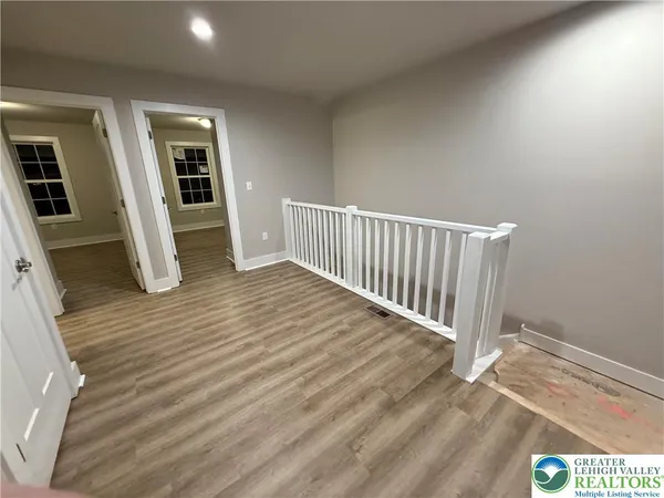 a view of entryway with wooden floor