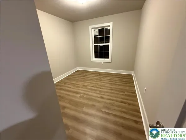 a view of an empty room with windows