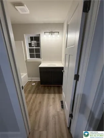 a view of entryway with wooden floor