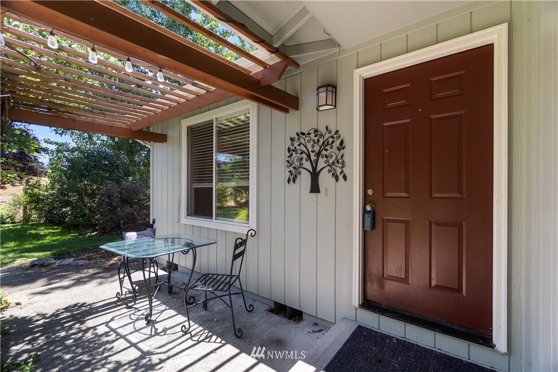 18135 Tamara Lane Southwest Rochester, WA 98579 - Photo 2 of 20 a front view of a house with outdoor seating