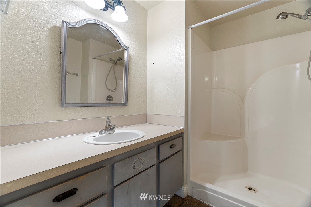 18135 Tamara Lane Southwest Rochester, WA 98579 - Photo 13 of 20 a bathroom with a sink and a mirror