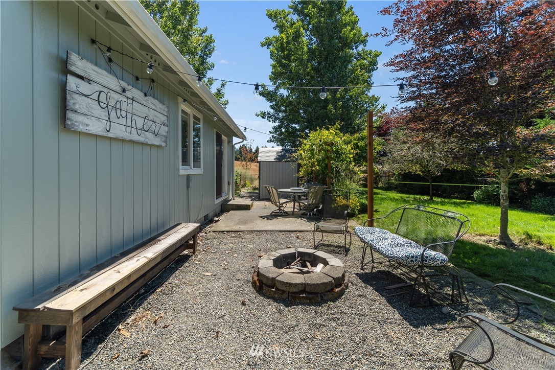 18135 Tamara Lane Southwest Rochester, WA 98579 - Photo 17 of 20 a backyard of a house with lots of green space