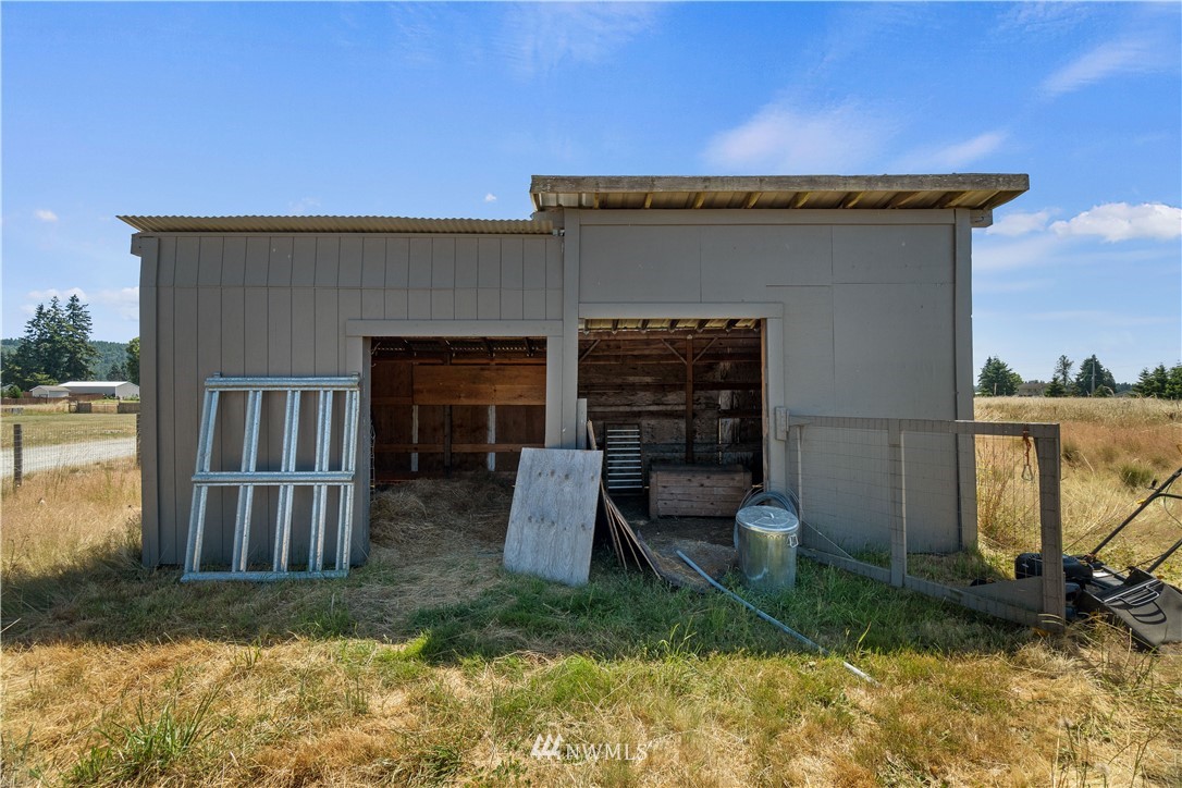 18135 Tamara Lane Southwest Rochester, WA 98579 - Photo 20 of 20 a view of house with backyard porch and furniture