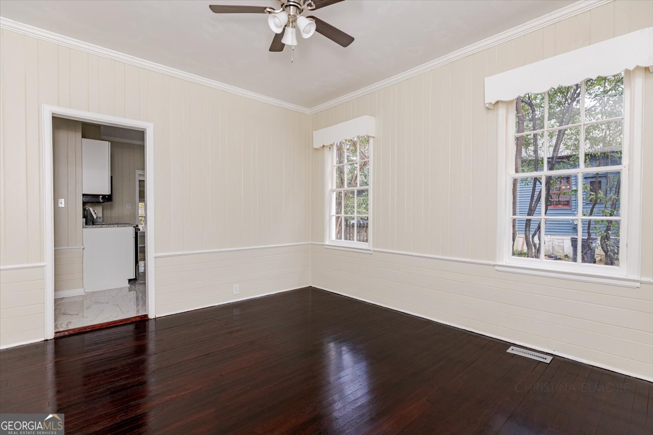 1205 Swift Street Perry, GA 31069 - Photo 14 of 63 a view of a livingroom with wooden floor and a window