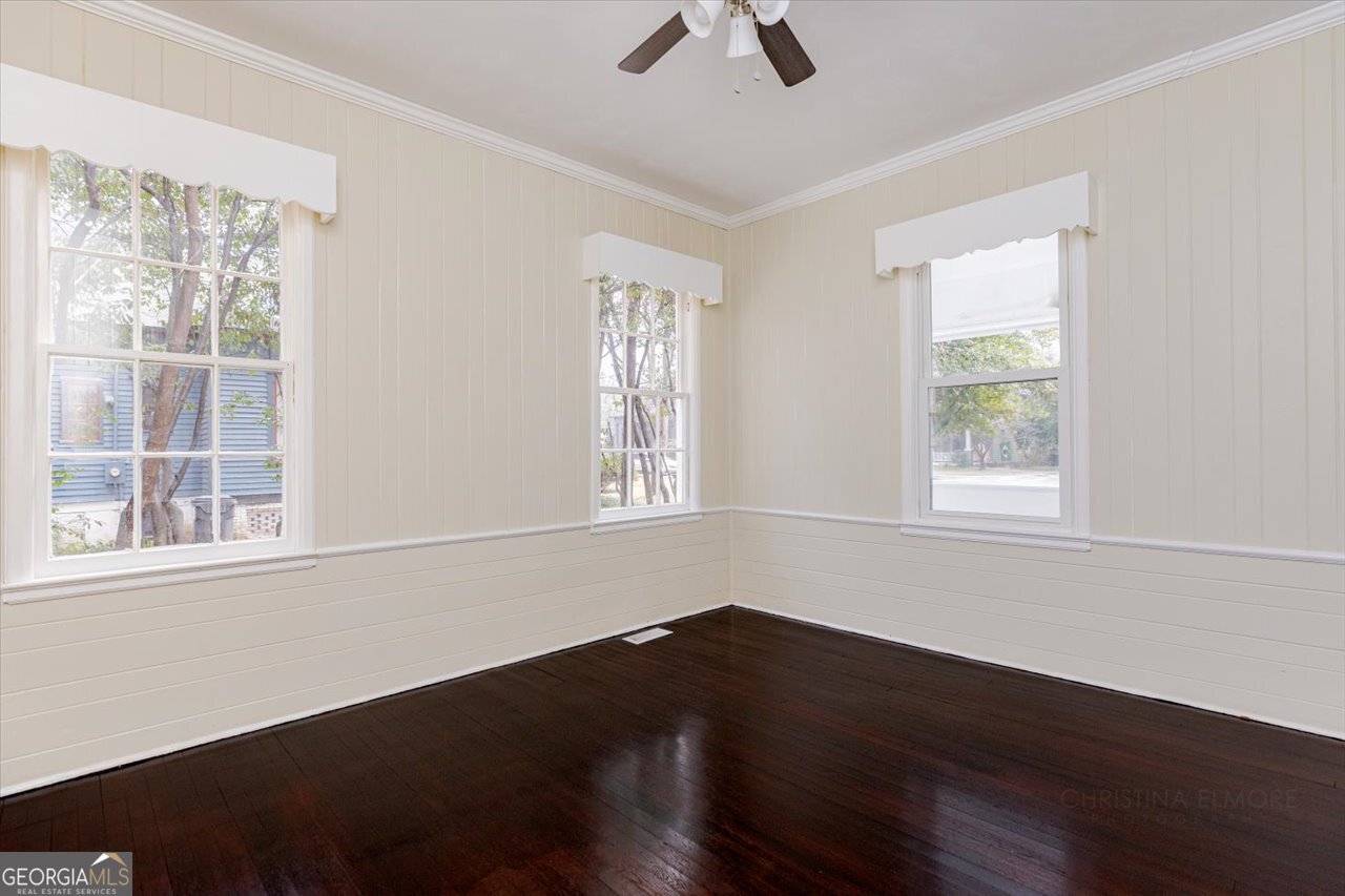 1205 Swift Street Perry, GA 31069 - Photo 15 of 63 a view of an empty room with wooden floor and a window