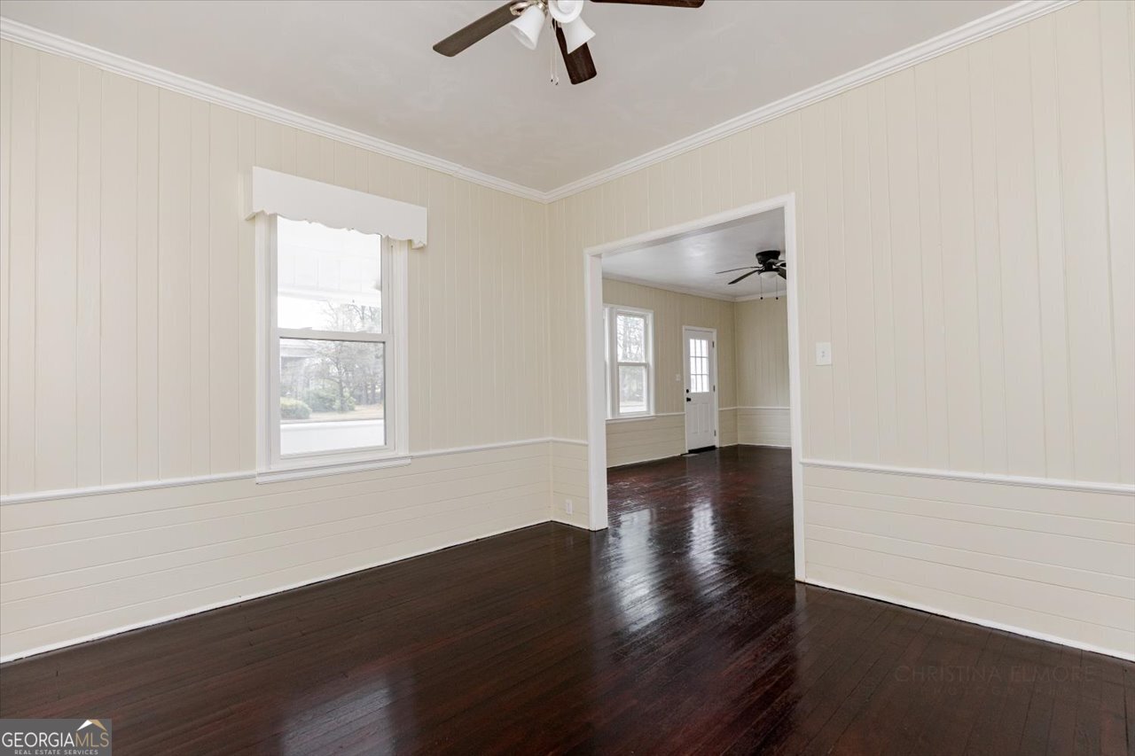 1205 Swift Street Perry, GA 31069 - Photo 16 of 63 wooden floor in an empty room with a window