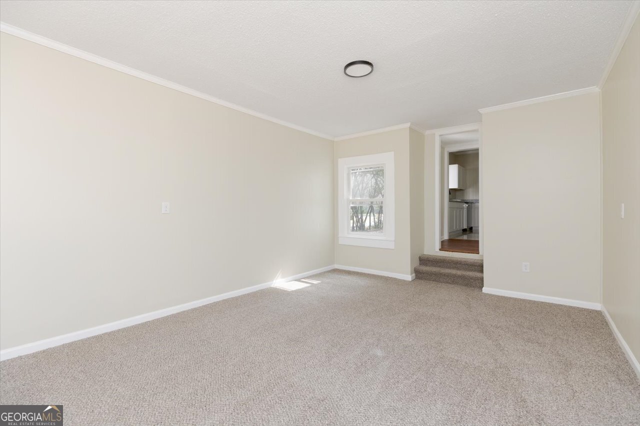1205 Swift Street Perry, GA 31069 - Photo 31 of 63 an empty room with windows and closet