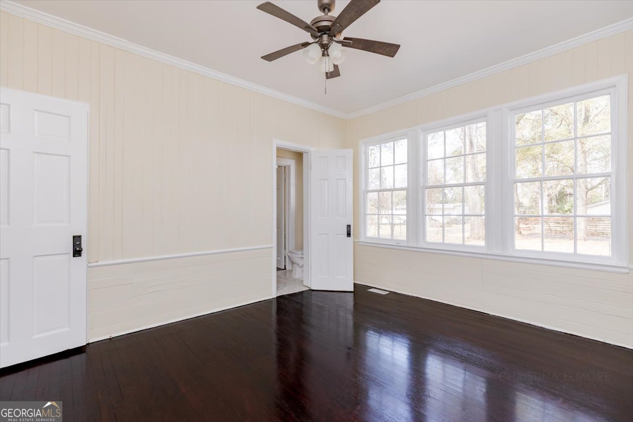 1205 Swift Street Perry, GA 31069 - Photo 33 of 63 wooden floor in an empty room with a window