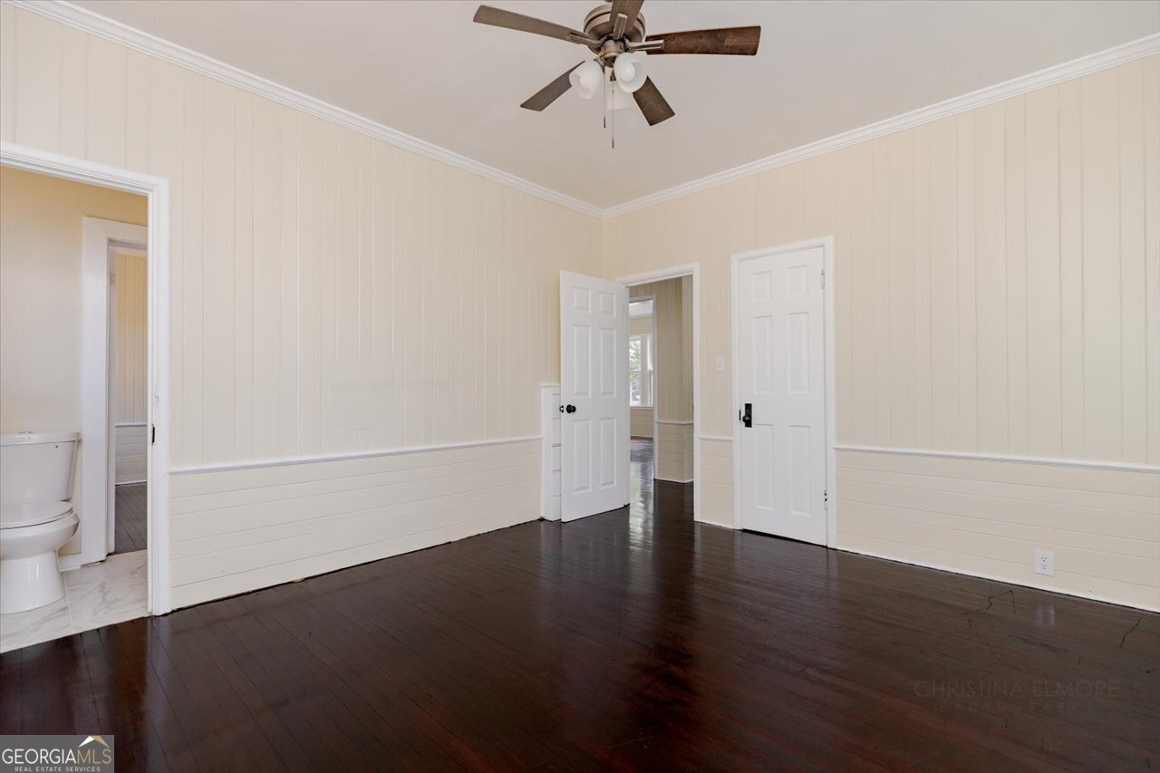 1205 Swift Street Perry, GA 31069 - Photo 40 of 63 a view of a room with wooden floor and white walls