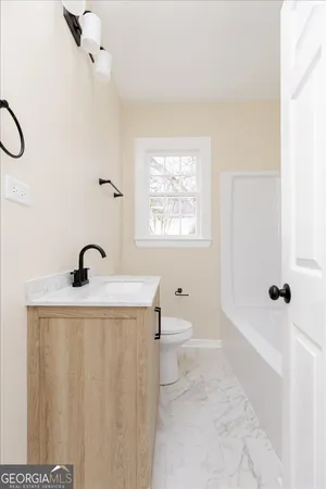 a view of a hallway with a white walls