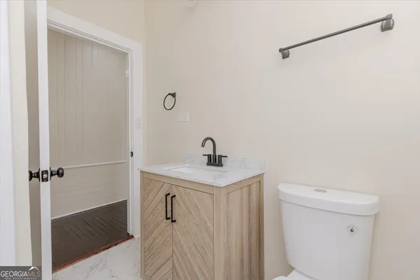 a bathroom with a toilet and a sink